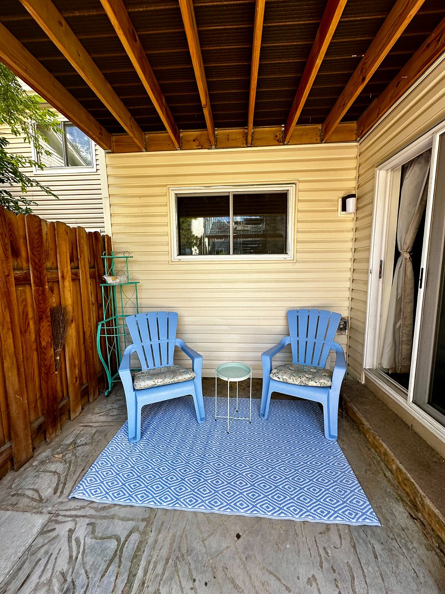 2nd sitting area on the patio of the yard. The master bedroom walks onto this shaded patio that is comfortable at any time of day!