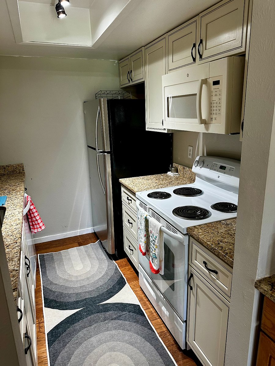 The upstairs full kitchen is fully stocked with multiple appliances and everything you need to cook delicious meals!