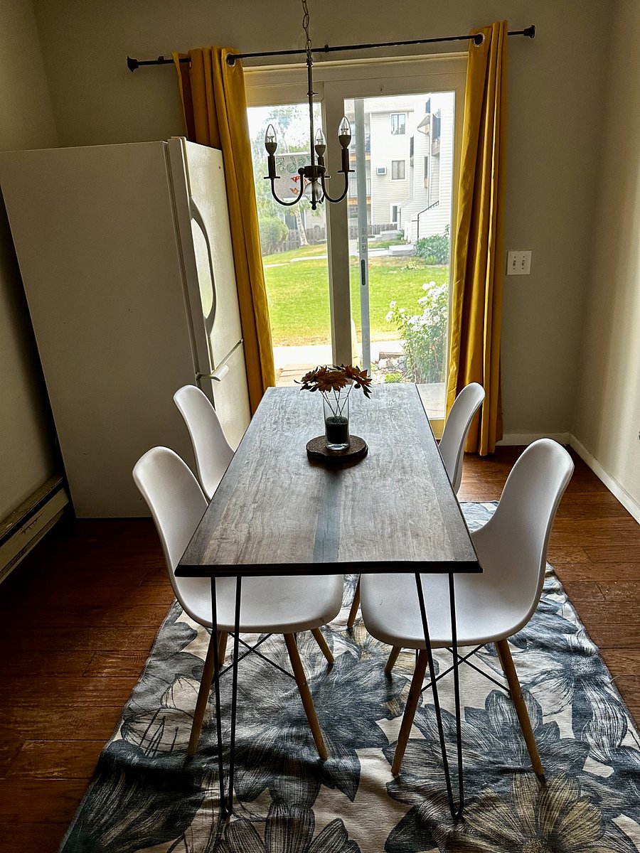 The dining room is bright and airy, and looks onto the patio.