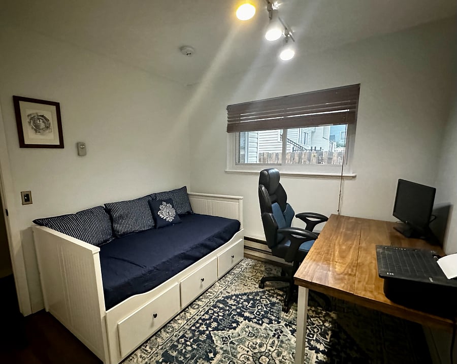 The second upstairs bedroom features a desk, comfortable chair, second monitor and printer for making working from home easy.