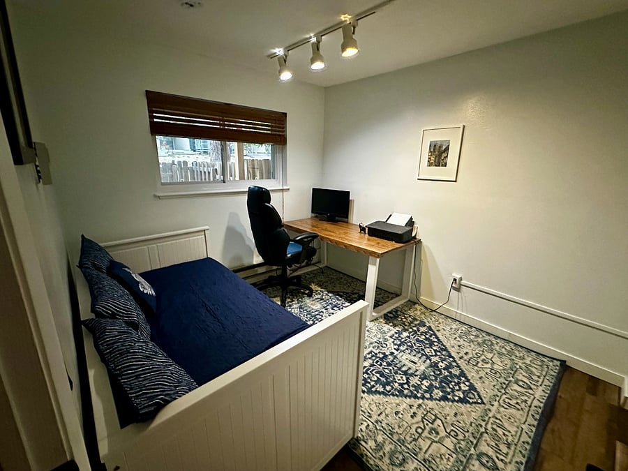 The second upstairs bedroom features a daybed that can be used as a couch or a twin bed. It also pulls out to be two twin beds or one king bed!