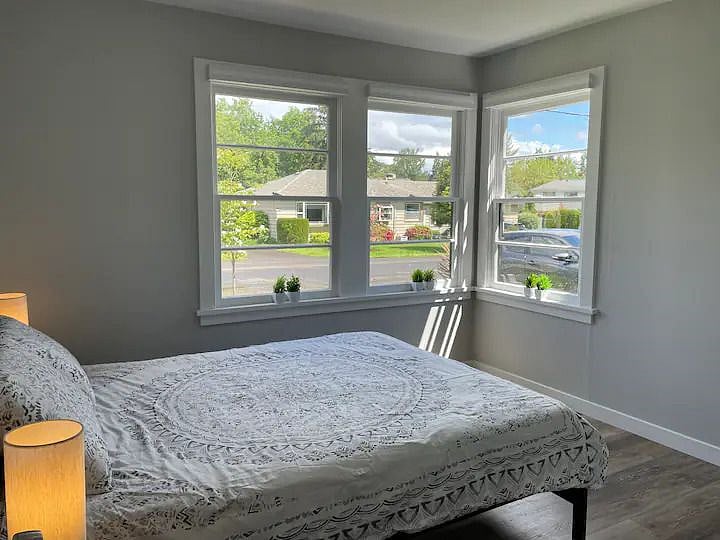 Bedroom 1 - queen bed with front street view.
