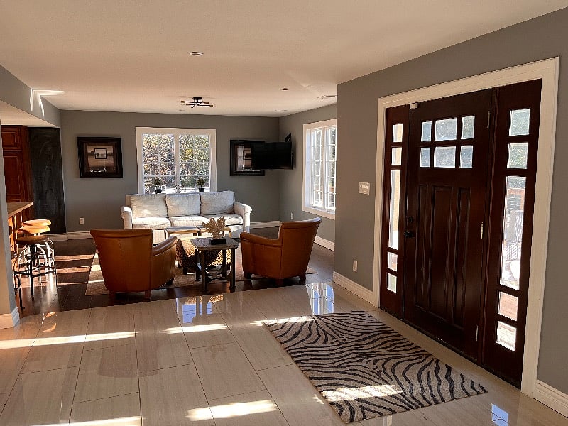 Front door and seating off of the kitchen.