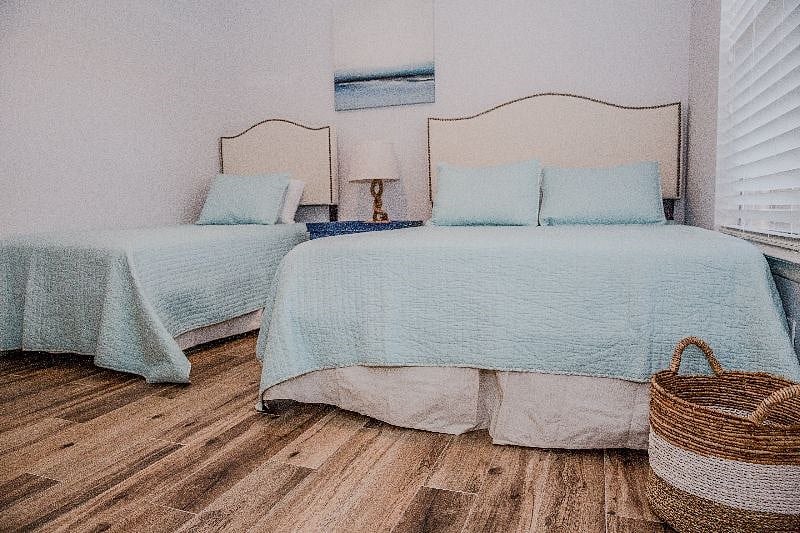 Twin and Queen size beds in the guest bedroom with memory foam mattresses.