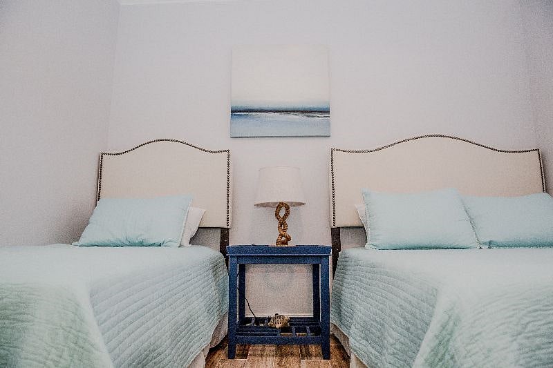 Twin and Queen size beds in the guest bedroom with memory foam mattresses.