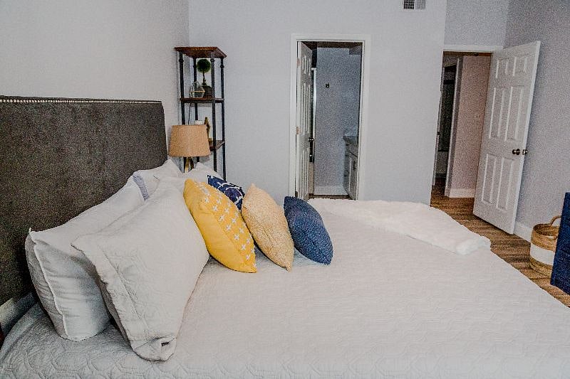 Primary bedroom features King size memory foam mattress and smart tv
