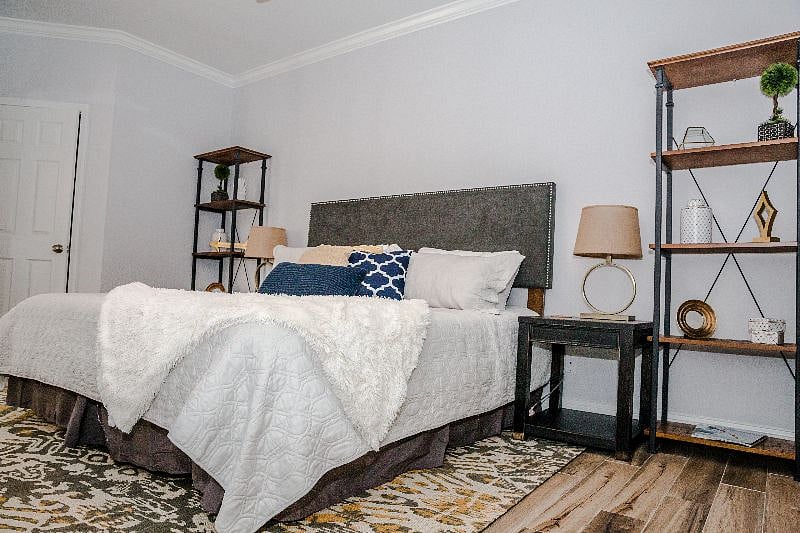 Primary bedroom features King size memory foam mattress and smart tv