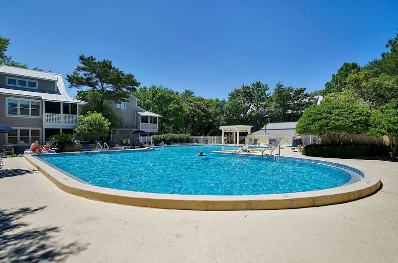 2 pools in the community. This huge pool is located in the middle of the community. A smaller pool is located between the unit and the beach and is heated year round.