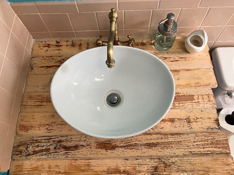 handmade reclaimed, wood sink. Ceramic, shark toothbrush holder.