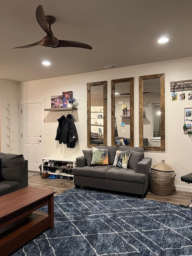 Living room mirrored accent wall.