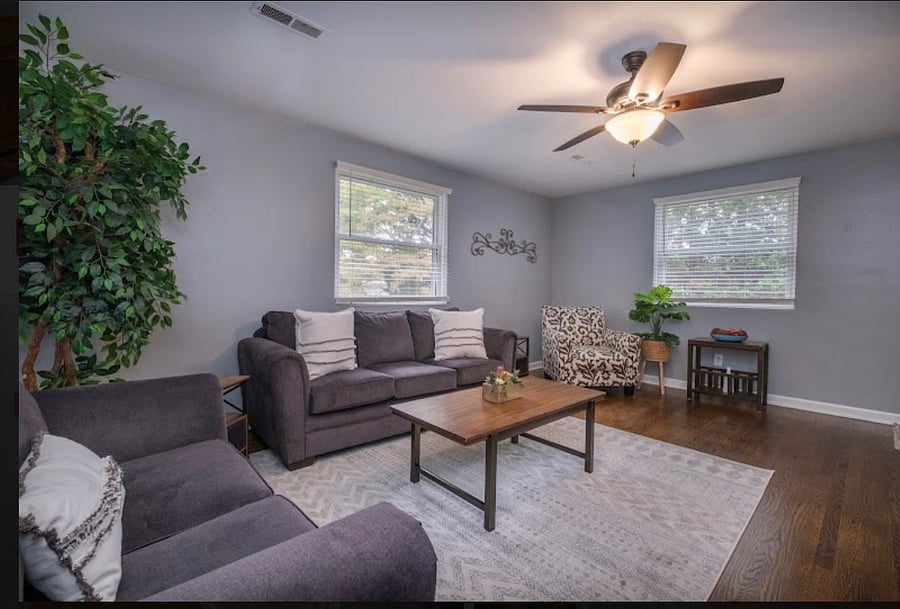 Large living room with refinished hardwood floors