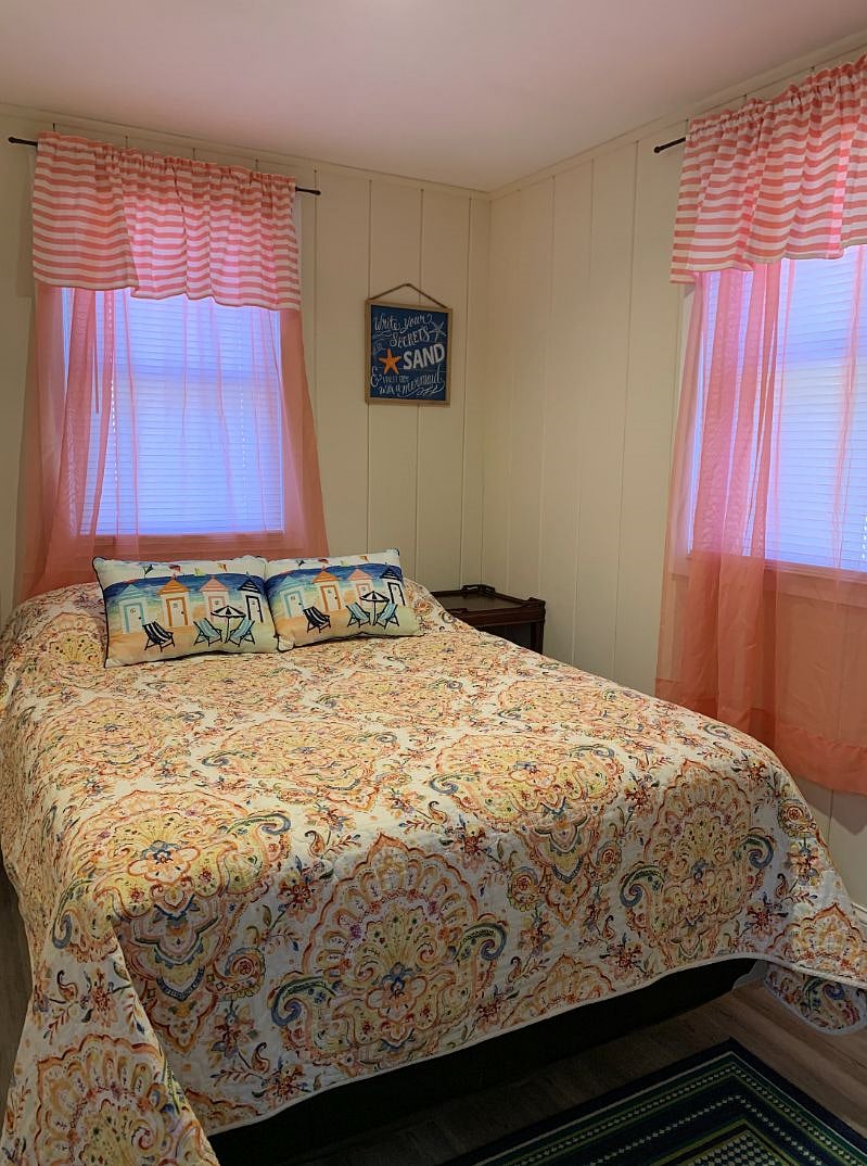 2nd Cottage bedroom with a full bed