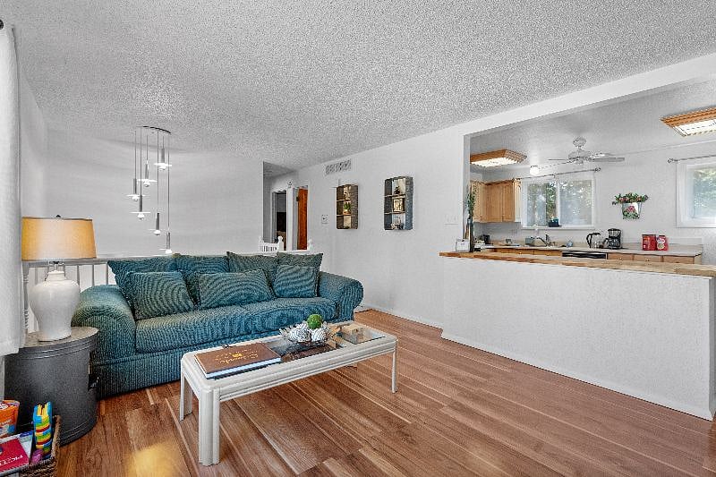 Couch and entry way into this unit.