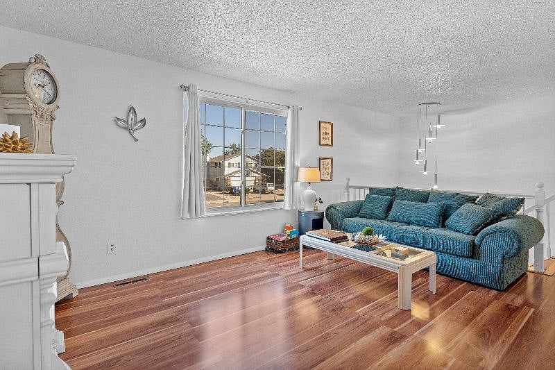 Couch and entry way into this unit. Window overlooks the front yard.