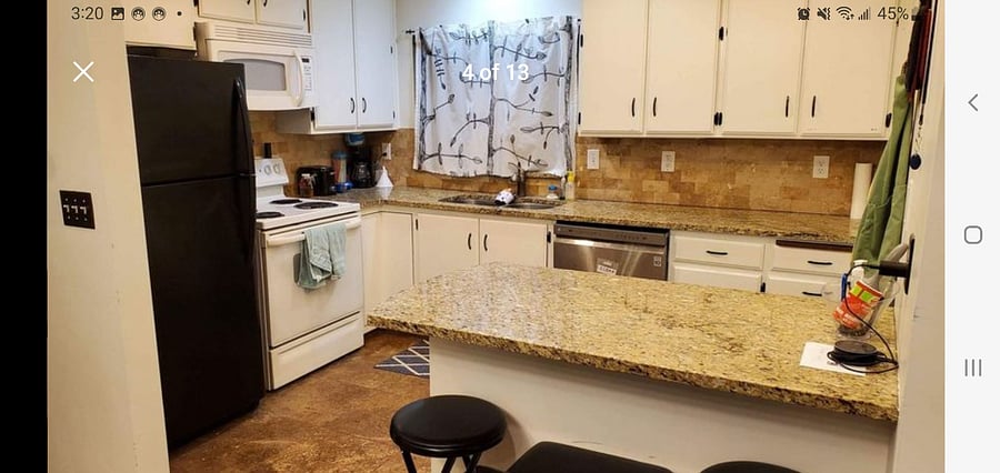 Kitchen with marble countertops and high quality tile