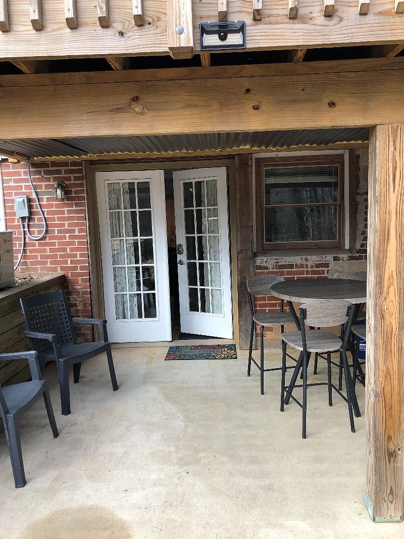 Private entry with key code lock and patio seating area