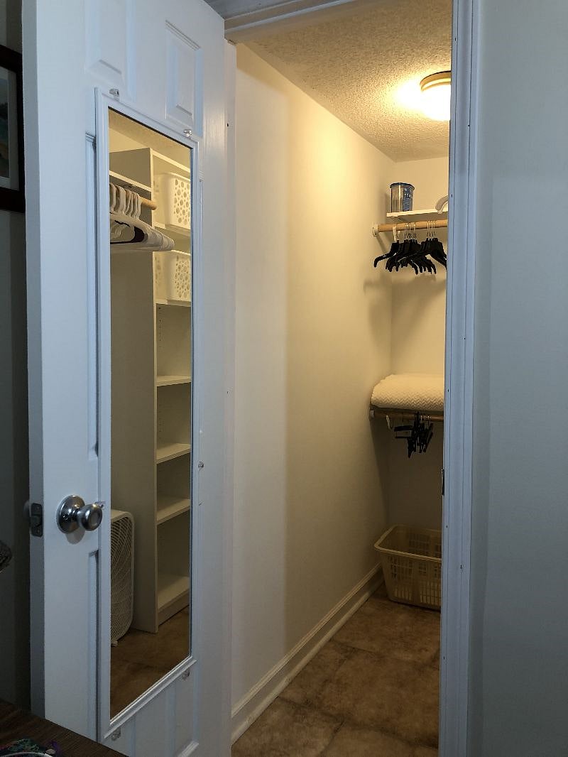 Full length mirror on back of closet door.