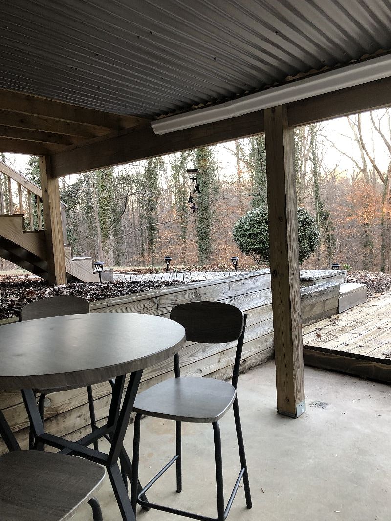 patio with table and 4 chairs for relaxing outside