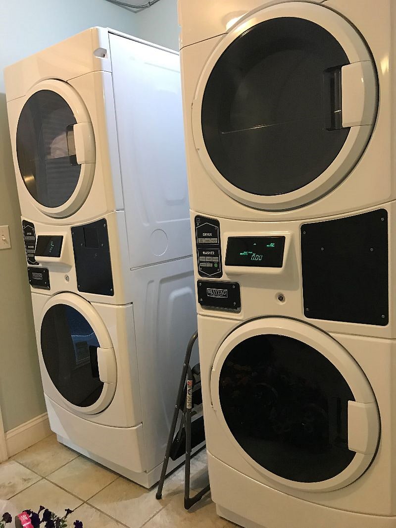 Laundry machines located in the office accessible during office hours.