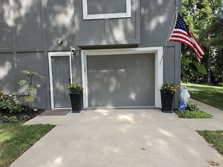 Off Street Parking. Enter the apartment to the right (under the flag) sidewalk