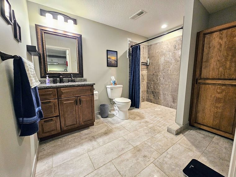 Bathroom with zero entry roll in shower