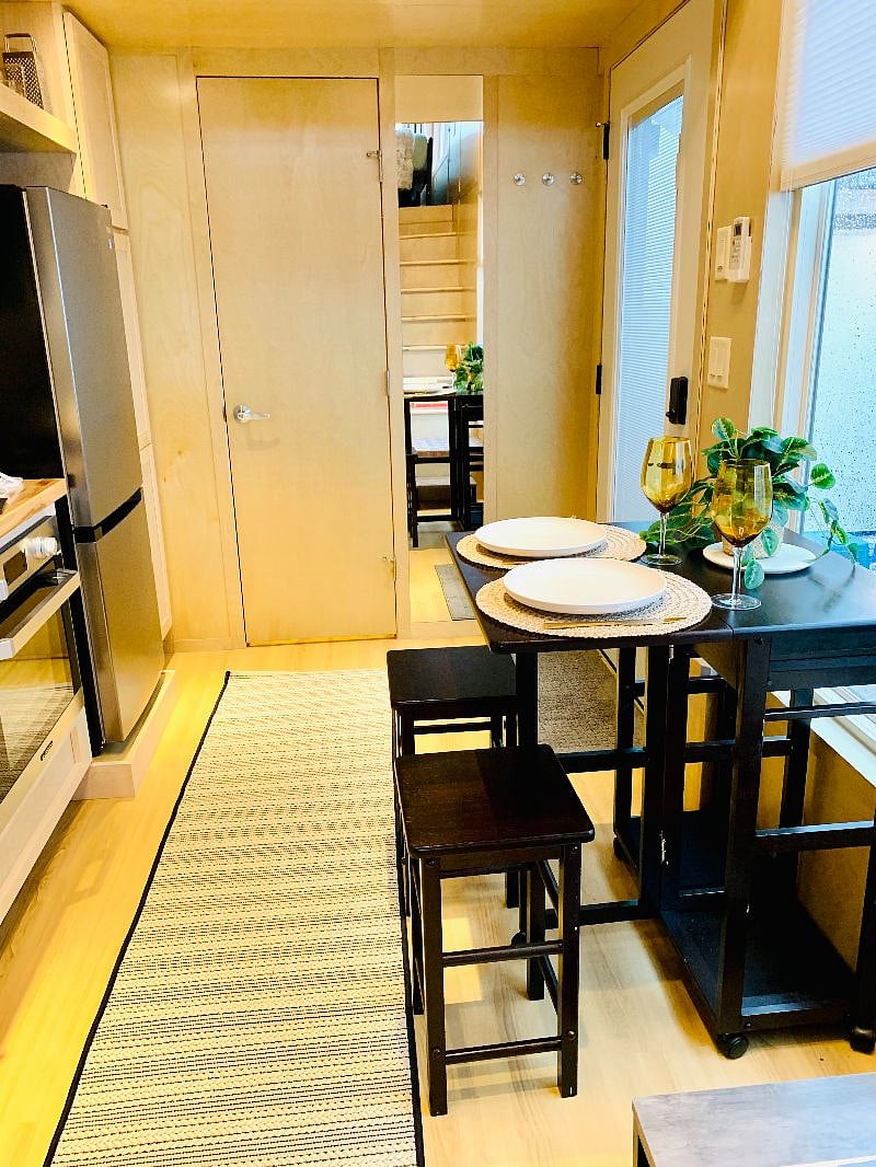 Kitchen island/dining table makes this space really cozy.
