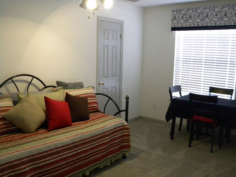 Loft day bed and work/game table with access to up bath and up bedroom.