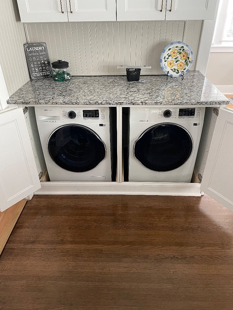 Compact Samsung Washer & Dryer concealed in Dining Room Cabinets