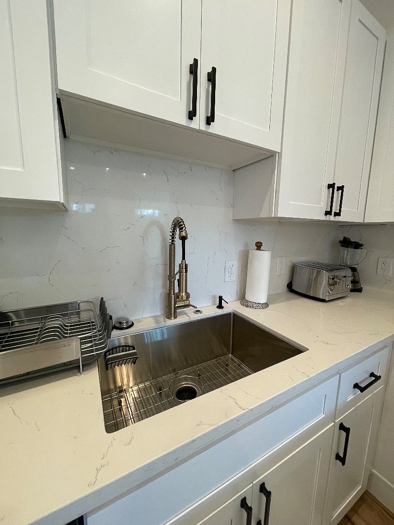 Designer touch faucet with powerful spray and designer sink. 