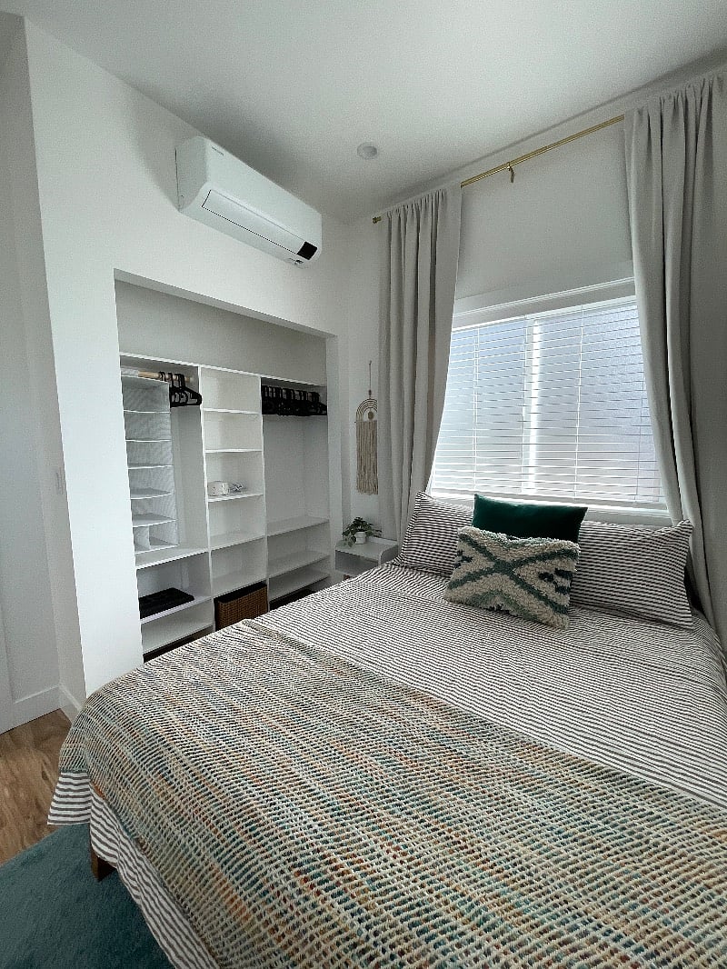 Bedroom is generously sized with built in closets and cabinets for plenty of storage. State-of-the-art split unit for the ultimate climate control.