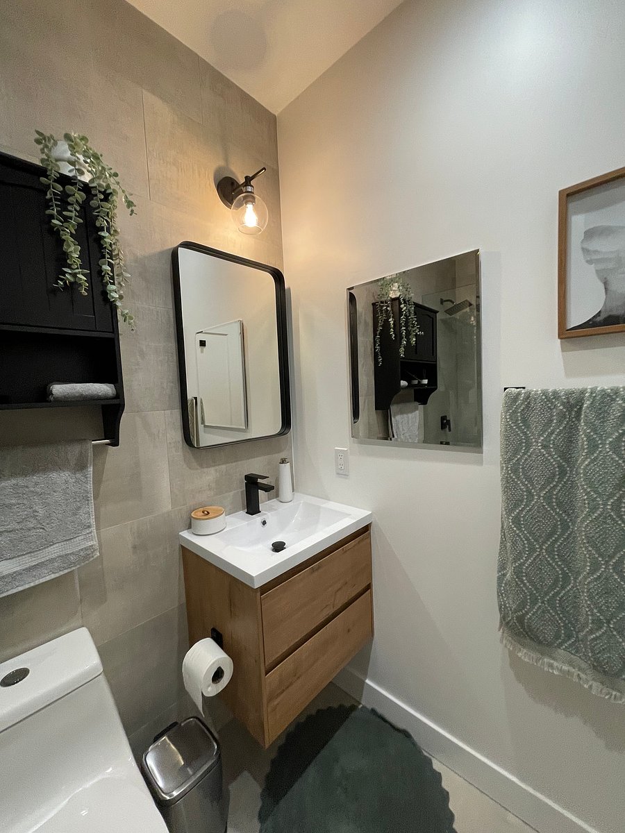 Mirror to right functions as a medicine cabinet for great organization and storage. 