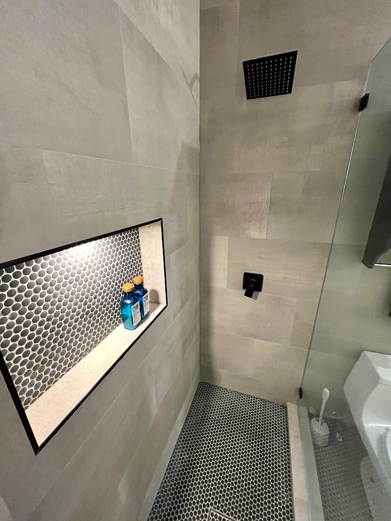 Huge shower niche with custom puck lighting. 
