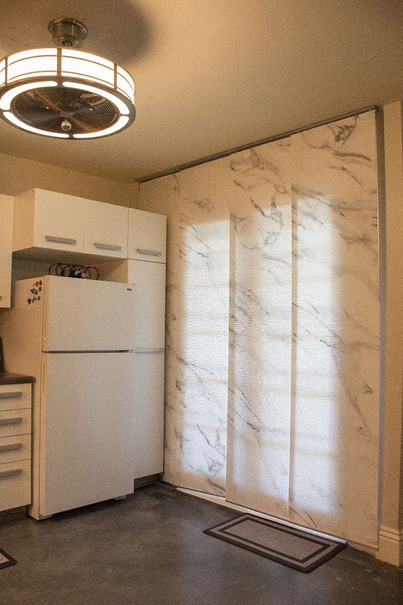 Retractable privacy shades covering french doors.
