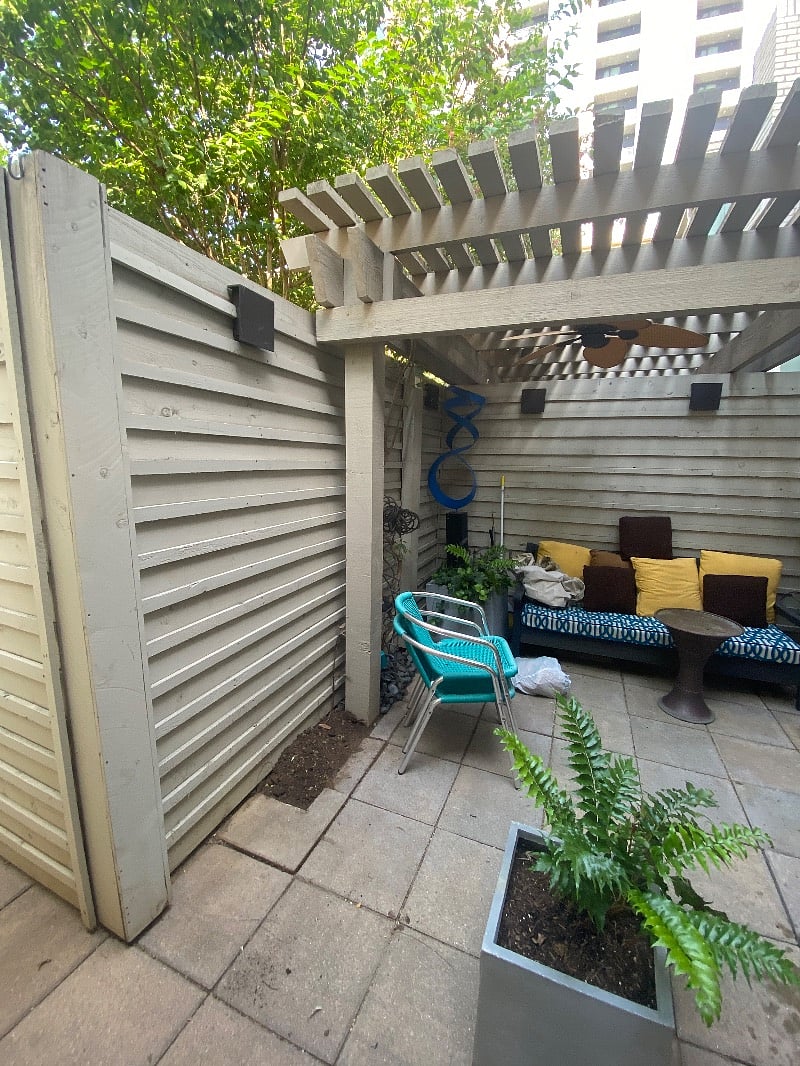 Very Private and Quiet gated patio area with ceiling fan and lighting.