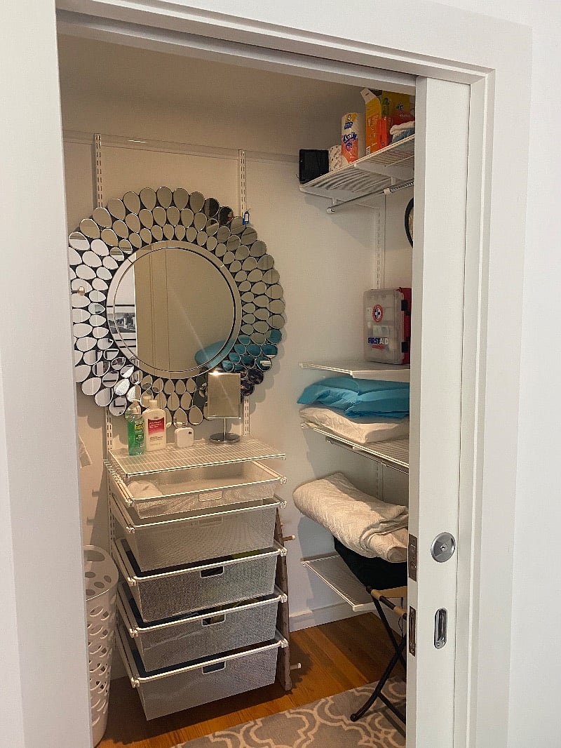 Large Walk In closet for your personal use with elfa shelving, drawers and a large mirror.