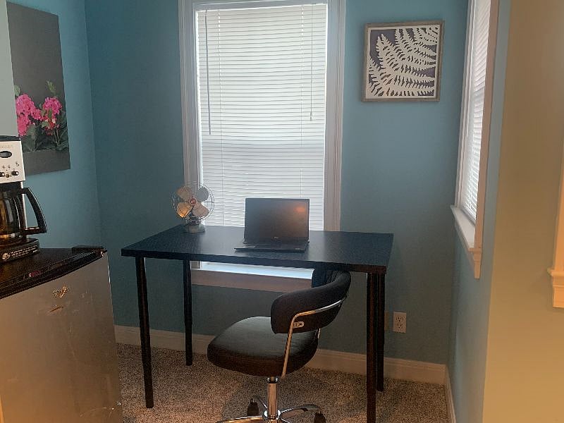 Living space - Desk, mini fridge and coffee area. Will be adding microwave soon.
