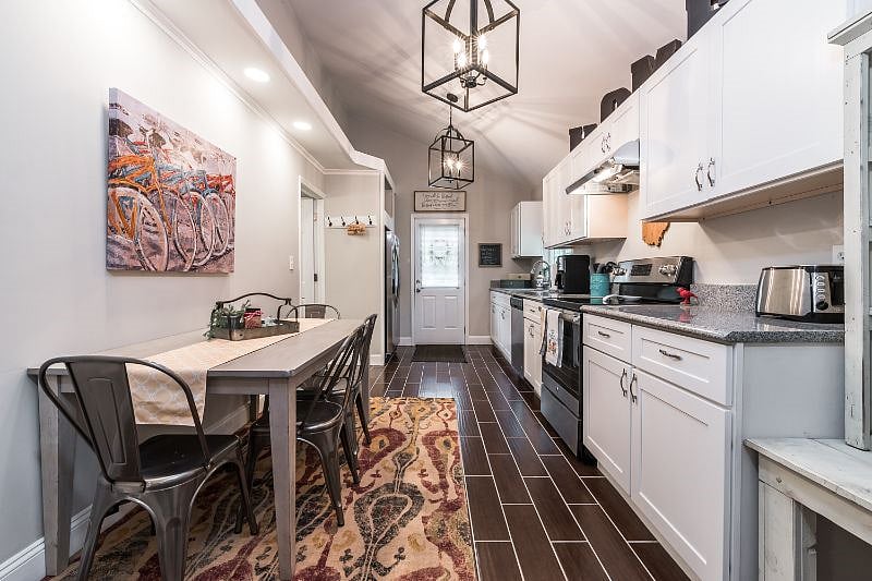 Kitchen with walkout to side and parking area.