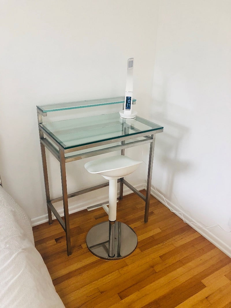 Desk and chair for studying with a lamp.