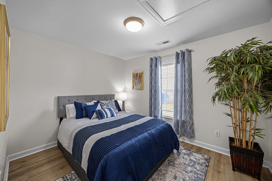 Secondary Bedroom has a full-sized bed with built-in storage.