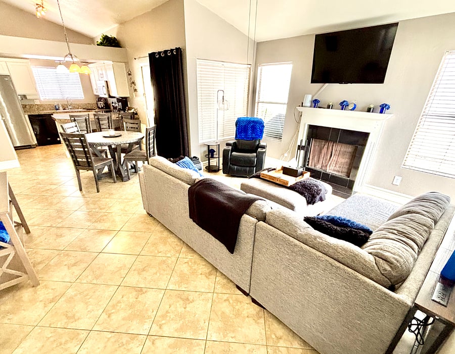 The open layout keeps the living, dining, and kitchen spaces comfortably connected. 