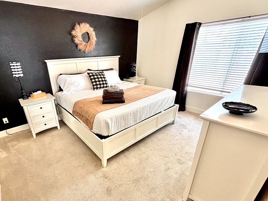 Rest well in the spacious bedroom with a king bed and generous storage.