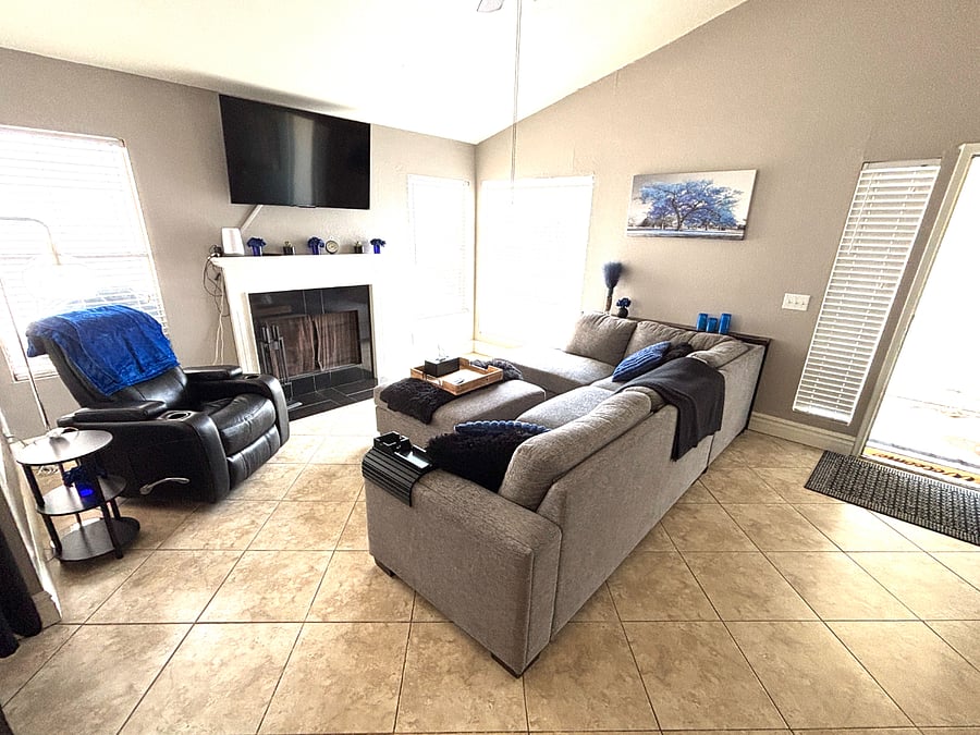 A cozy fireplace and large TV make evenings at home feel easy. With plenty of comfortable seating for quiet nights, conversation, or movie time.