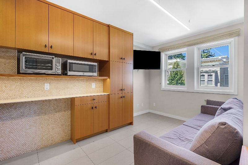 Wall of storage in honey-colored Douglas Fir cabinets
