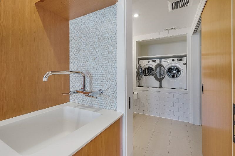 View into bathroom from kitchen it can be closed off with a pocket door