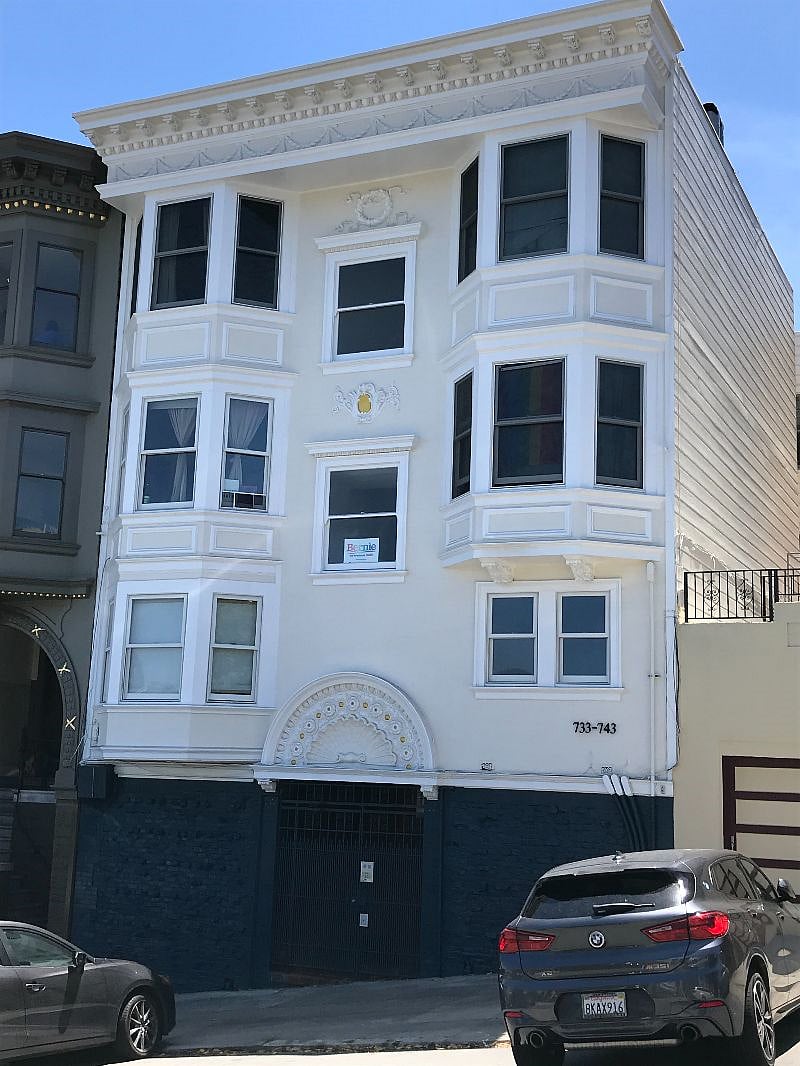 Building facade, 735 Waller at lower right up one flight of stairs from street