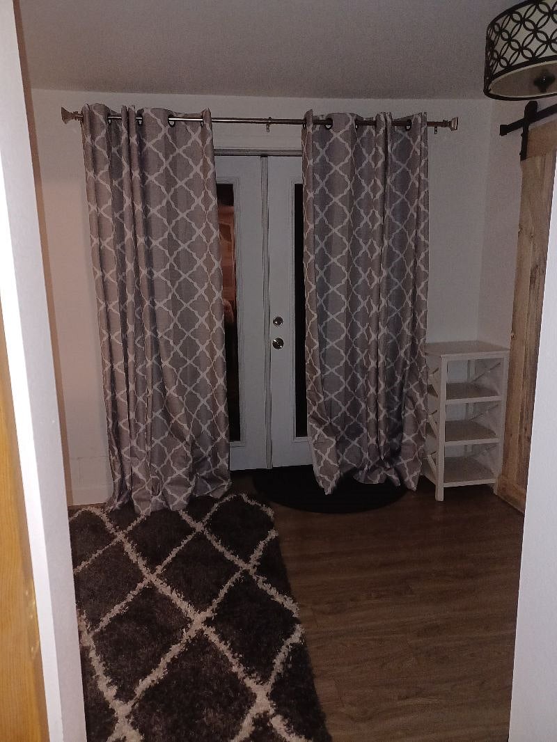 Bedroom French doors leading out to back yard.