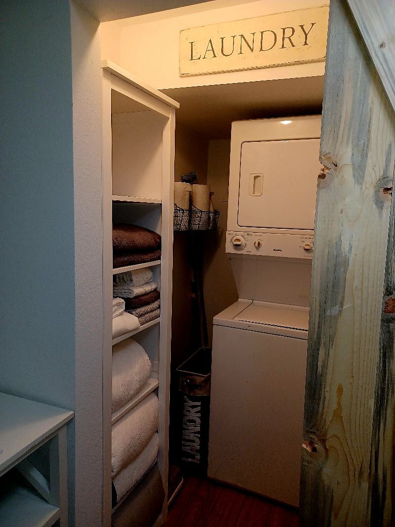 A place to wash/dry clothes, store linens, paper towels or maybe luggage for your next trip!