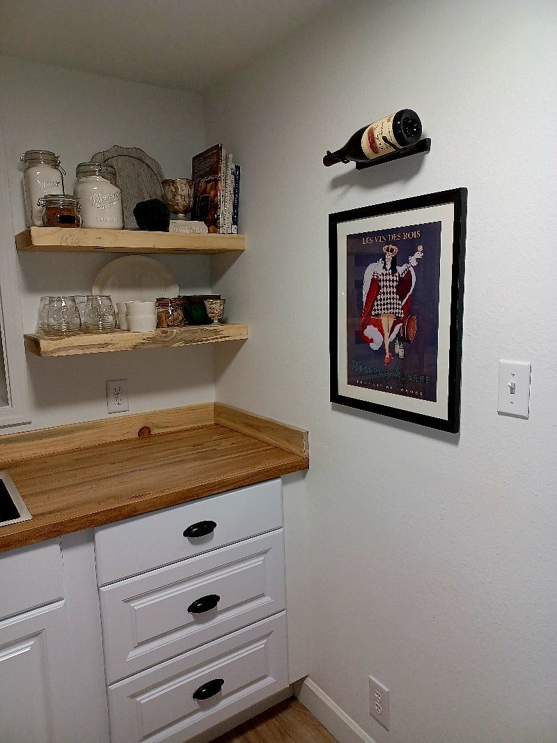 le kitchen with a bottle of vino as a reminder to break bread with family and friends.