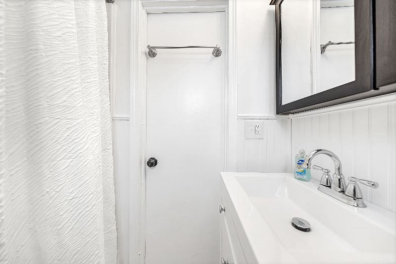 Bathroom with a surround tub