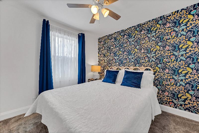 Bedroom #1 with a queen size bed on the second floor with a window into the backyard